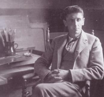 Carl Ahrens seated in his Roycroft studio c. 1900, black and white photograph
